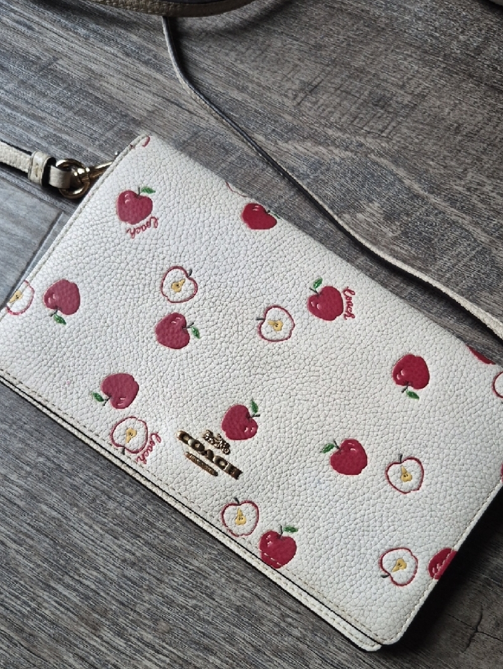 Coach Anna Foldover Clutch Crossbody Bag in a white color with a red apple print - Picture 4 of 16